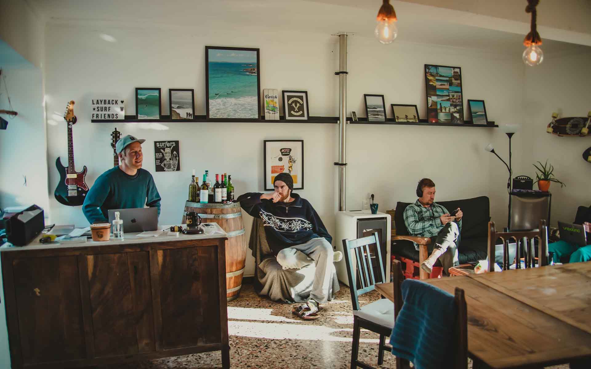 Living room of the surf house with people