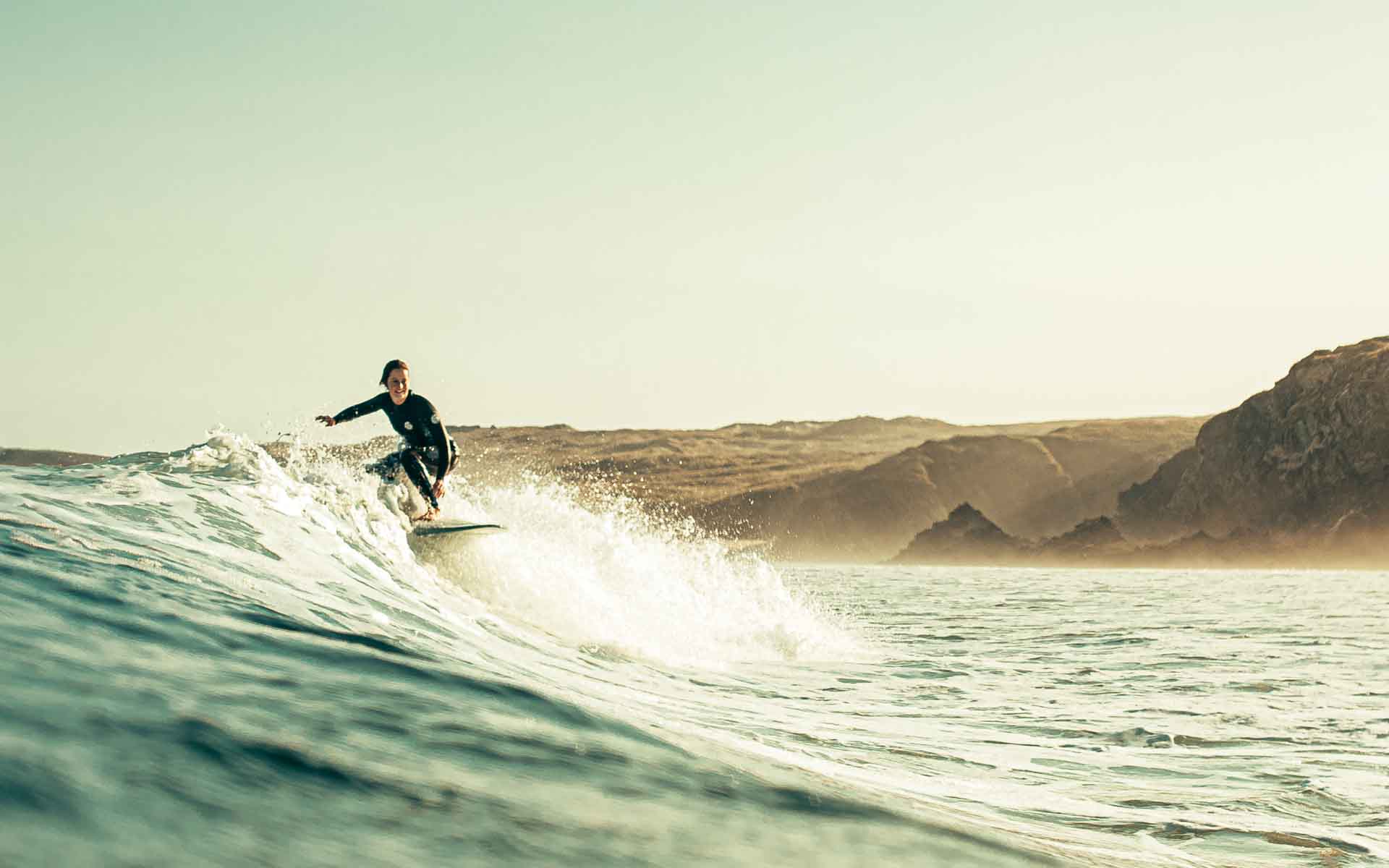 surfer on top of a wave