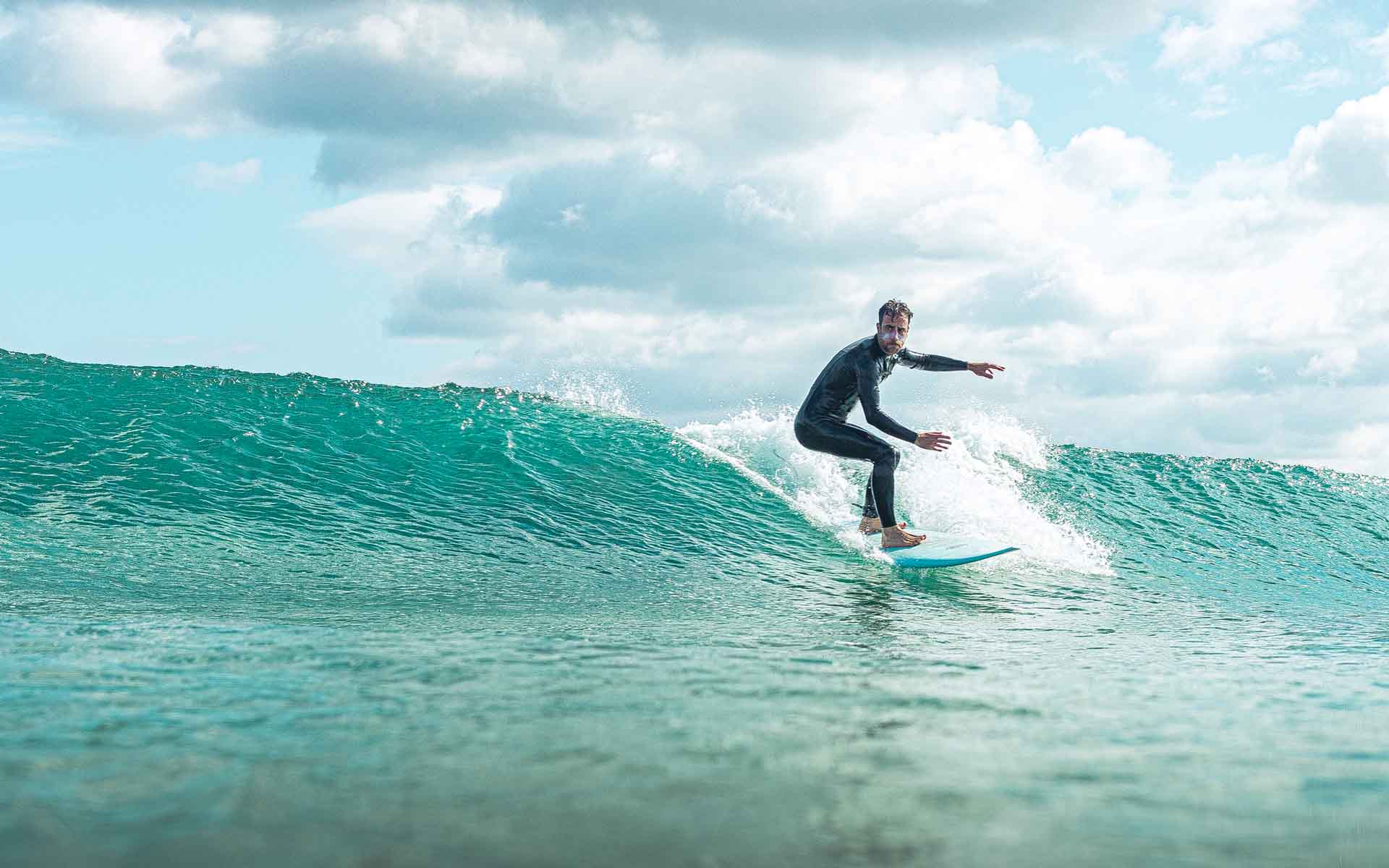 surf student on backside wave